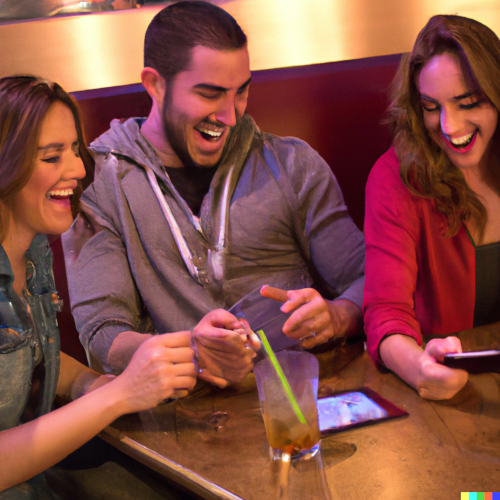 Three patrons laughing around a table at a bar, playing along on their phones.